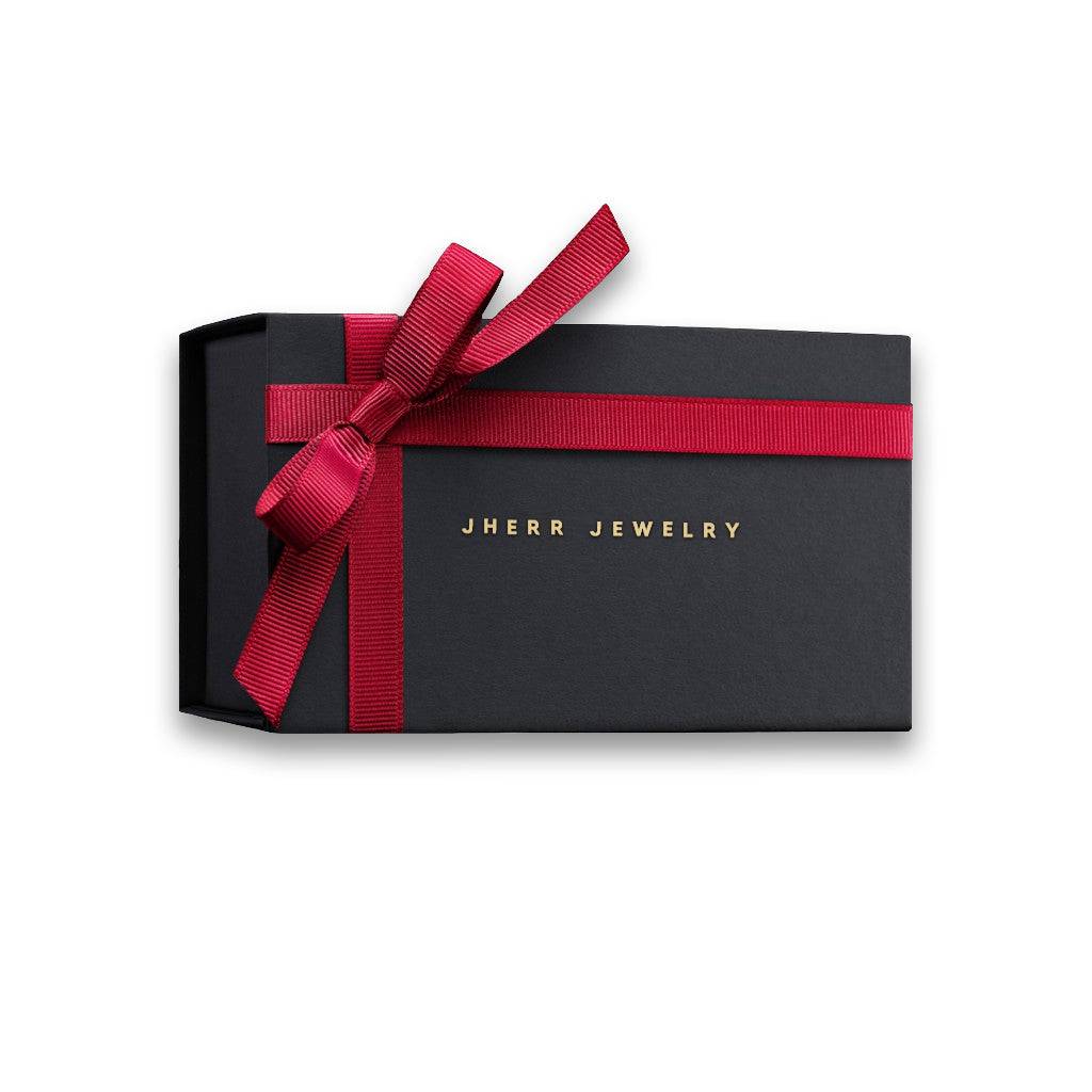 a black box with a red ribbon around it