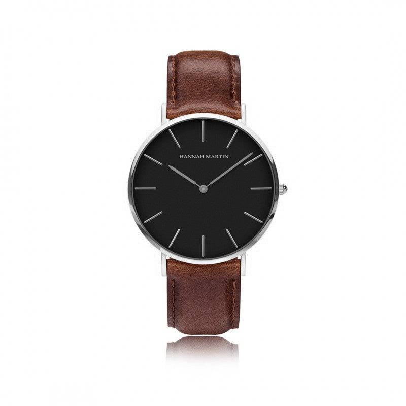 a black and brown watch on a white background