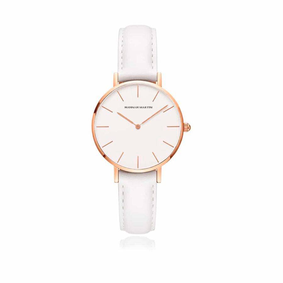 a white watch with a rose gold case