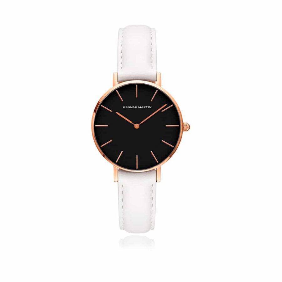 a black and white watch on a white strap