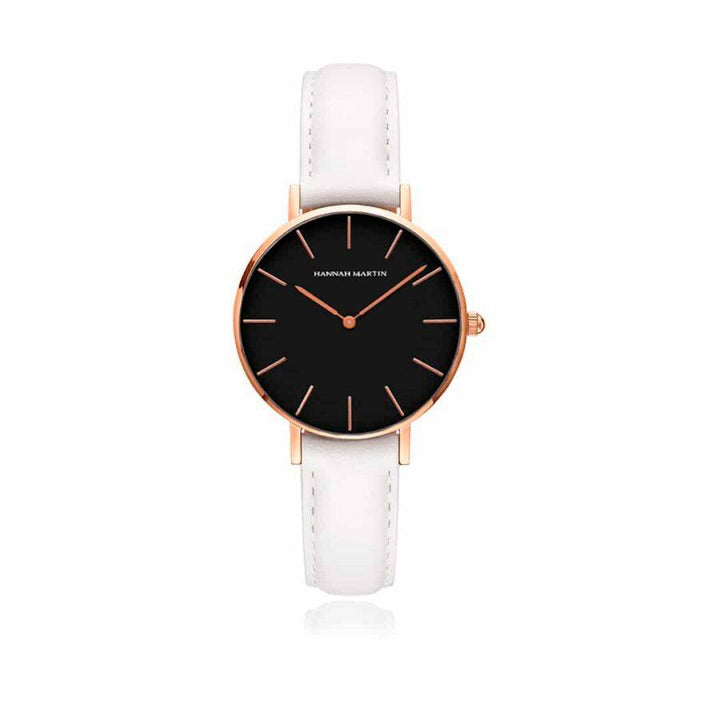 a black and white watch on a white strap
