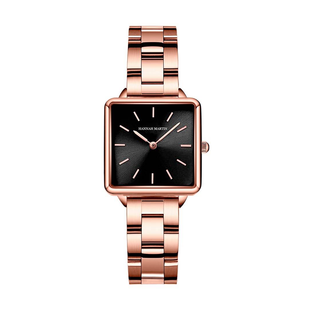 a rose gold watch with a black face