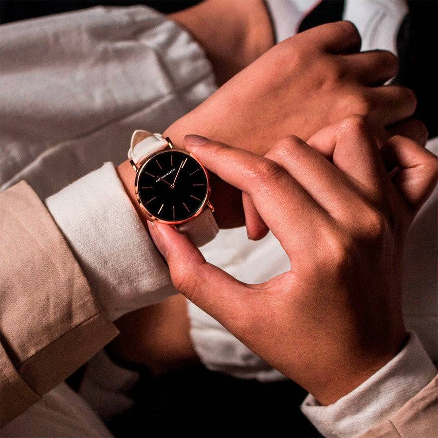 a person wearing a watch while sitting down