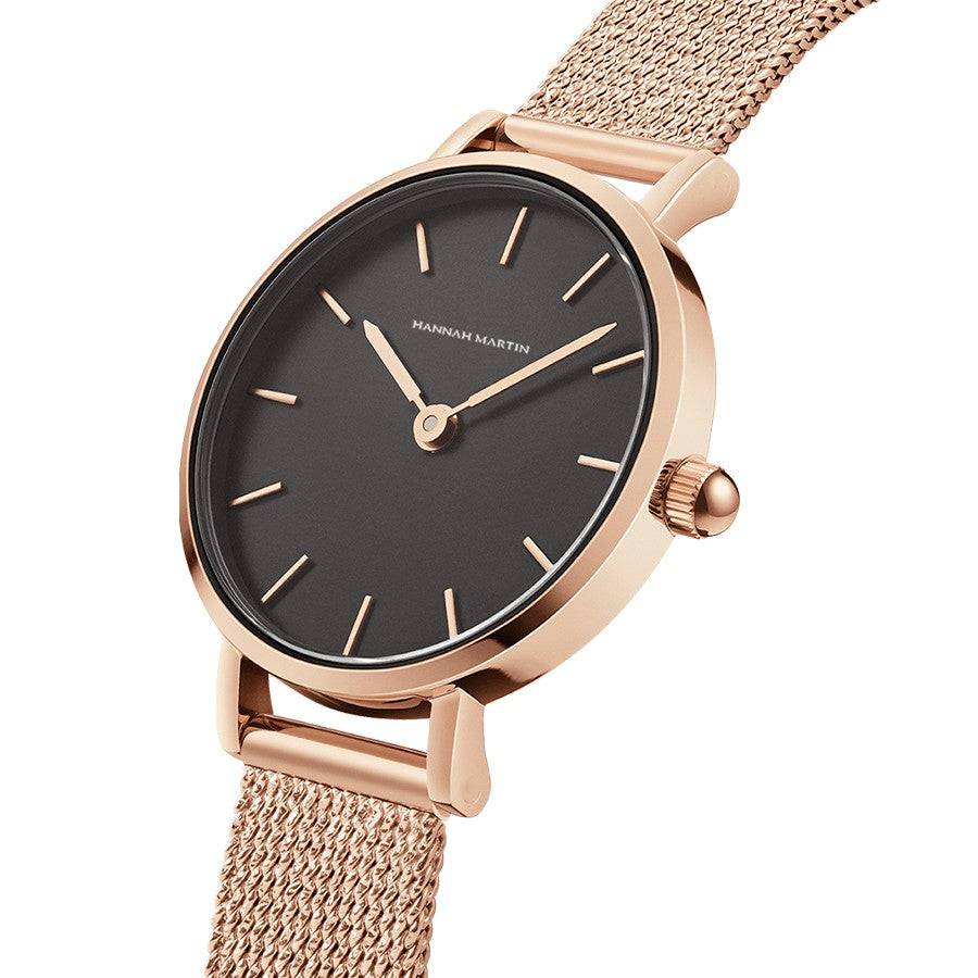 a rose gold watch with a black face
