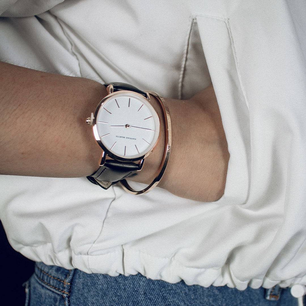 a close up of a person wearing a watch