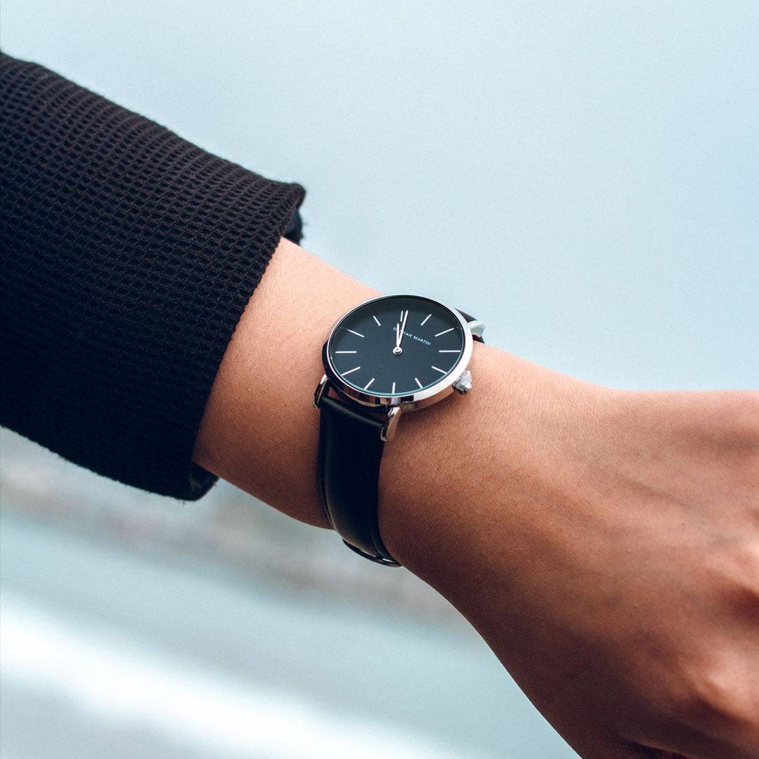 a close up of a person wearing a watch