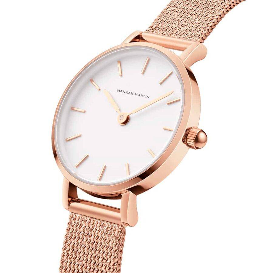 a rose gold watch with a white dial