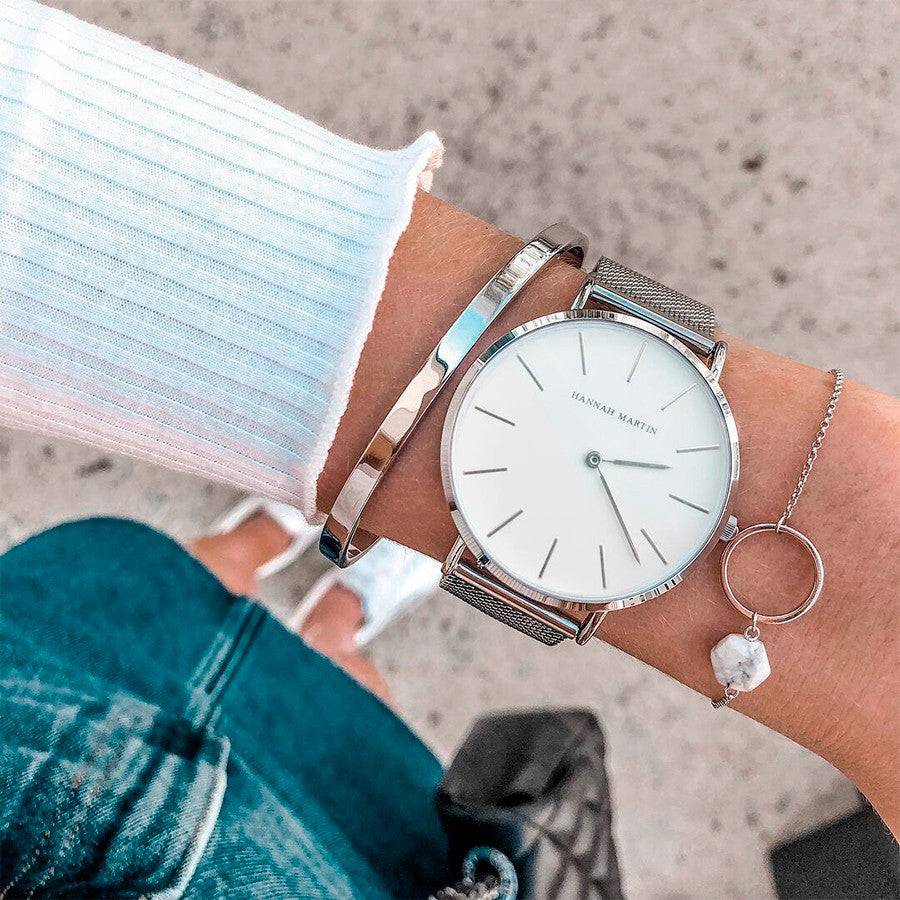 a close up of a person wearing a wrist watch