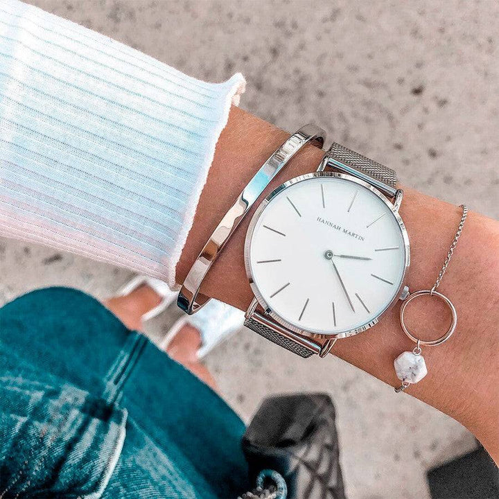 a close up of a person wearing a wrist watch
