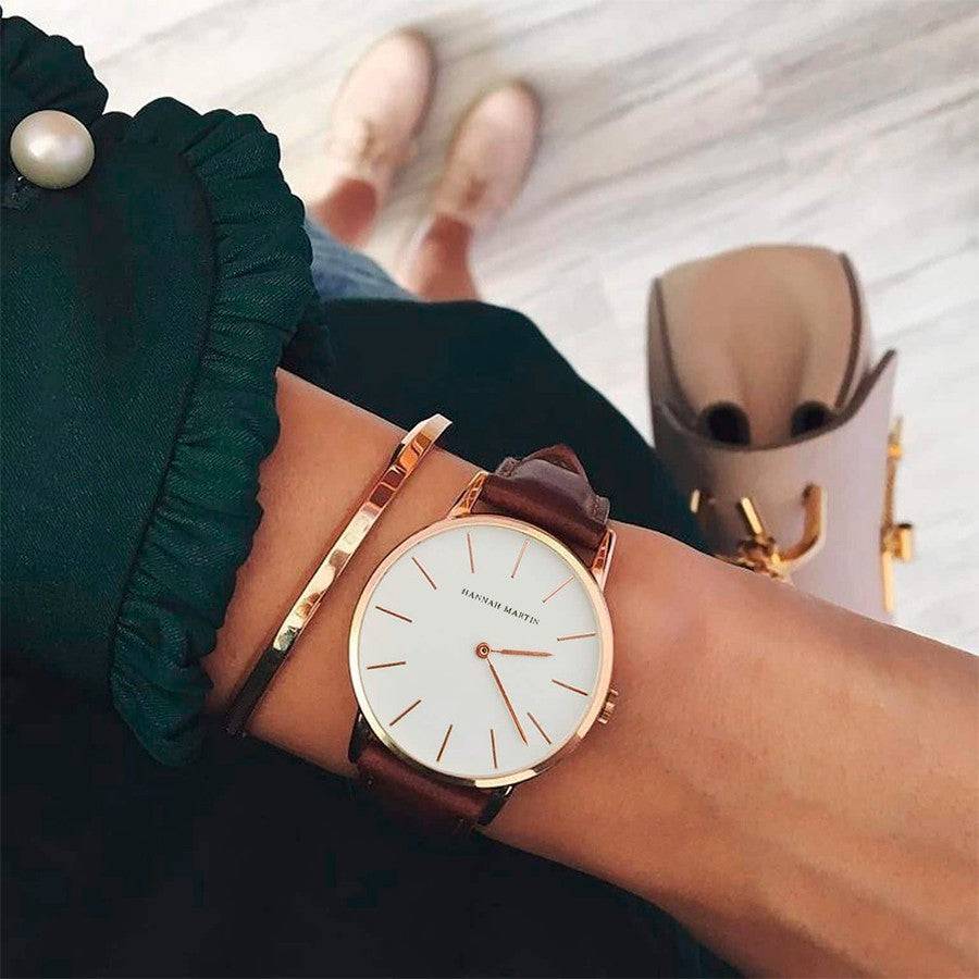 a woman wearing a watch on her wrist