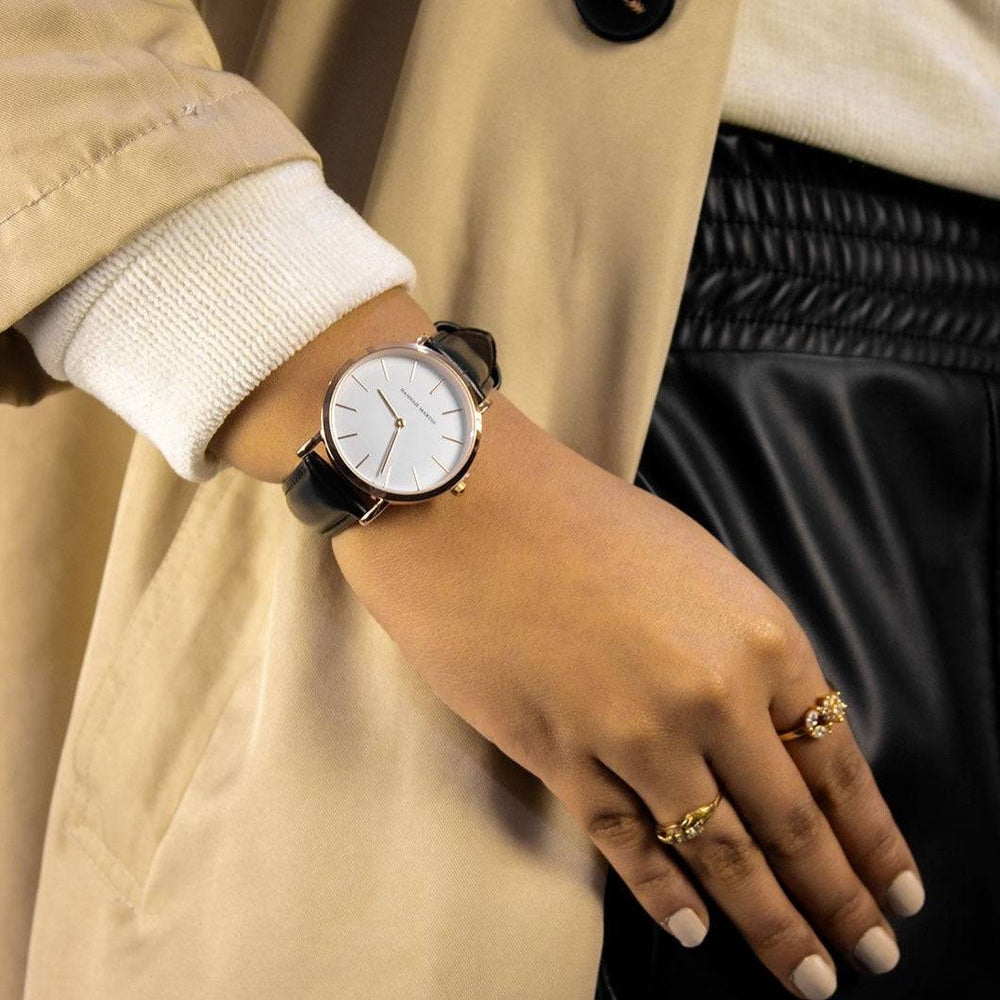 a close up of a person wearing a watch
